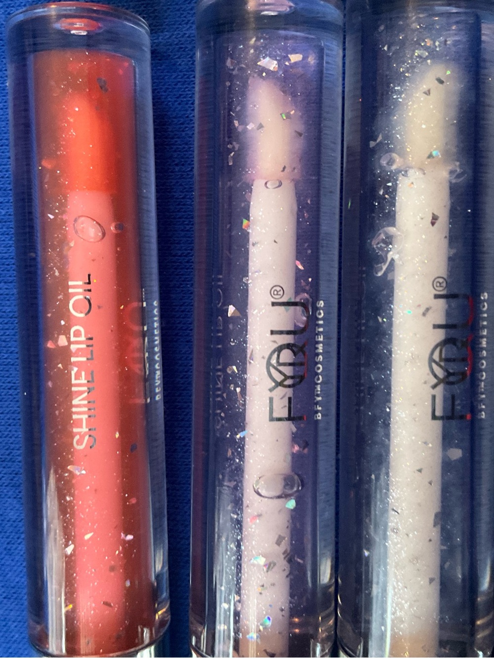 Fyrli Shine Lip Oil Trio — Coral, Lavender, Clear.. Totsl of 5